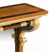 A striking George IV amboyna, rosewood and gilt console table attributed to Morel and Seddon