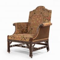 A late Victorian oversized arm chair in the Chippendale manner