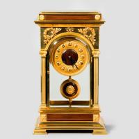 An unusual and superb quality rectangular four glass ormolu mantel clock