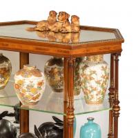 Hexagonal walnut display table attributed to Holland and Sons