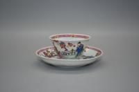 Depicting figures in a garden scene, decorated with overglaze polychrome enamels.  China  Yongzheng/Qianlong Reign: 18th century  Cup: H: 3.5cm D: 6.3cm   Saucer: 10.3cm D