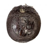 Naïve rounded coconut shell “bugbear” powder flask with silver mounts