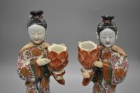A pair of famille-rose figures candle holders