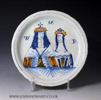 English delftware plate with two figures in a landscape, London 18th century