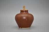 A Brown-Glazed Miniature Jar
