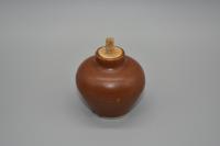 A Brown-Glazed Miniature Jar