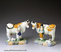 Pair of antique Yorkshire pottery prattware cows with attendants, Mexborough Pottery