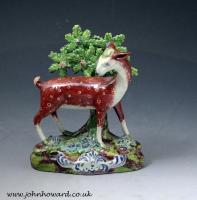 Staffordshire pearlware pottery bocage figure of a doe deer standing on a base, antique period early 19th century