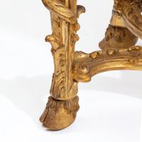 A superb pair of giltwood console tables with original marble tops