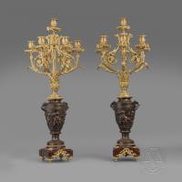 A Fine Pair of Gilt and Patinated Bronze Seven-Light Candelabra, After A Model By Clodion, Cast by Suse Frères.   French, Circa 1890.  