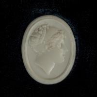 A white vitreous paste cameo of Emma, Lady Hamilton, attributed to William Tassie