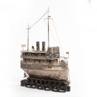 A Chinese silver model of a river steamer, with three tiers of cabins