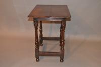 A very small early 18th century oak centre table