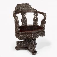 A Meiji period carved hardwood desk and chair