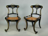 Pair of stylish Regency ebonised hall chairs with gilt metal mounts, c.1810