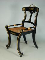 Pair of stylish Regency ebonised hall chairs with gilt metal mounts, c.1810