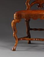 A Set Of Twelve Carved Walnut Dining Chairs Of Unusual Undulating Form