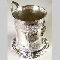 Antique 19th century English repoussé silver tankard