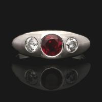 A beautiful platinum, ruby and old European cut diamond gypsy-set ring