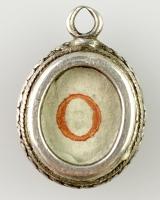 Silver 'O' reliquary pendant. Spanish, late 17th century | BADA