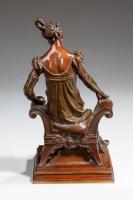  A bronze of an edwardian lady on a window seat