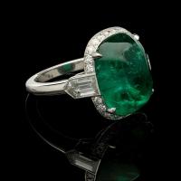 8.59ct Sugarloaf cabochon Colombian emerald ring with diamond halo set in platinum