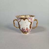 Meissen two-handled beaker and saucer, the saucer circa 1724