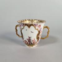 Meissen two-handled beaker and saucer, the saucer circa 1724