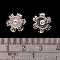 A beautiful pair of platinum and pear-shaped diamond flower head earrings