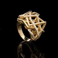 A beautiful yellow gold and round brilliant diamond Disorient ring of openwork sculptural design