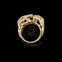 A beautiful yellow gold and round brilliant diamond Disorient ring of openwork sculptural design