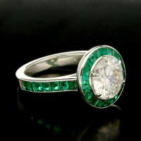 A stunning 2.39ct old European brilliant cut diamond ring with calibre cut emerald surround