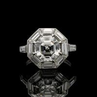 3.02ct Vintage octagonal step-cut diamond ring with geometric diamond surround in platinum