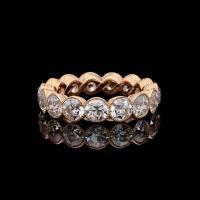 A stunning diamond full eternity ring set with 4.90cts of old European cut diamonds in rose gold