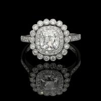 A beautiful 1.04ct old mine cushion cut diamond ring with double diamond cluster
