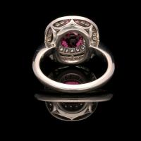 A beautiful 1.85ct vibrant pink sapphire ring with diamond double halo in platinum