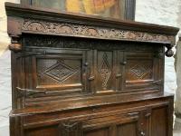 A WELL DOCUMENTATED 17TH CENTURY LAKELAND OAK COURT CUPBOARD. INITIALLED MT AND DATED 1658.