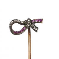 Antique Tie Pin of a Tied Ribbon with Diamonds & Burma Rubies, French circa 1880.