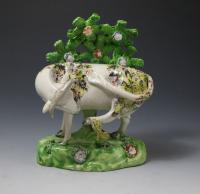 Staffordshire pottery pair of figures with bocage of cows early 19th century