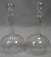 A pair of crystal glass shaft & globe decanters engraved with stars English c.1870
