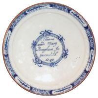 A rare, Dutch, delftware plate inscribed 'Thomas and Mary Bingham In Yarmouth' & dated '1742'