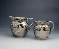 Silver luster pottery pitchers with resist decoration English circa 1820 period