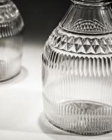 A Pair of Slice Cut Regency Decanters with Diamond Cut Band