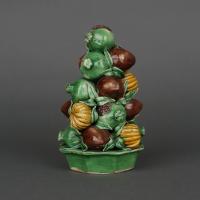 A Chinese porcelain famille verte biscuit fruit pyramid group, Early Kangxi, circa 1680