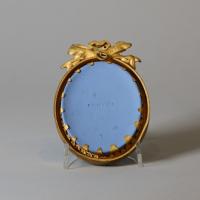 Wedgwood blue jasper oval plaque sprigged in white with the 'Three Graces watering Pegasus'