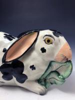 Staffordshire pottery figure of a rabbit nibbling on leaves mid 19th century