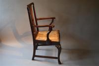 An unusual George II walnut armchair