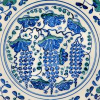 A Large Rimless Iznik Dish Decorated with Grapes