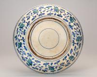 A Large Rimless Iznik Dish Decorated with Grapes back