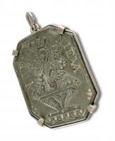 Pendant set with a slate relief of Our Lady of Nieva. Spain, 17th century